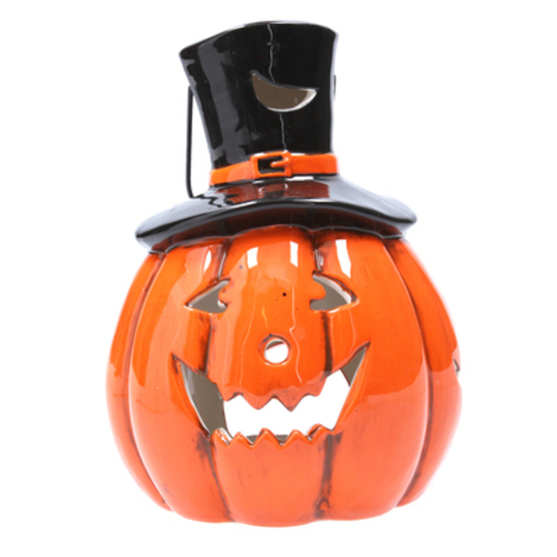 This ceramic Halloween pumpkin wearing a tophat tealight holder is made by designer Gisela Graham.  Perfect to scare little trick or treaters on Halloween night. Fits standard size tealights.  This Halloween candle holder will make a great addition to your halloween decorations.